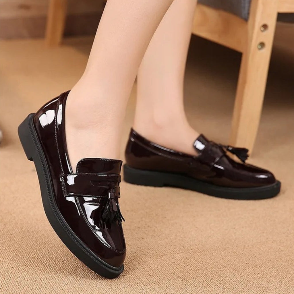 Women's black patent tassel loafers