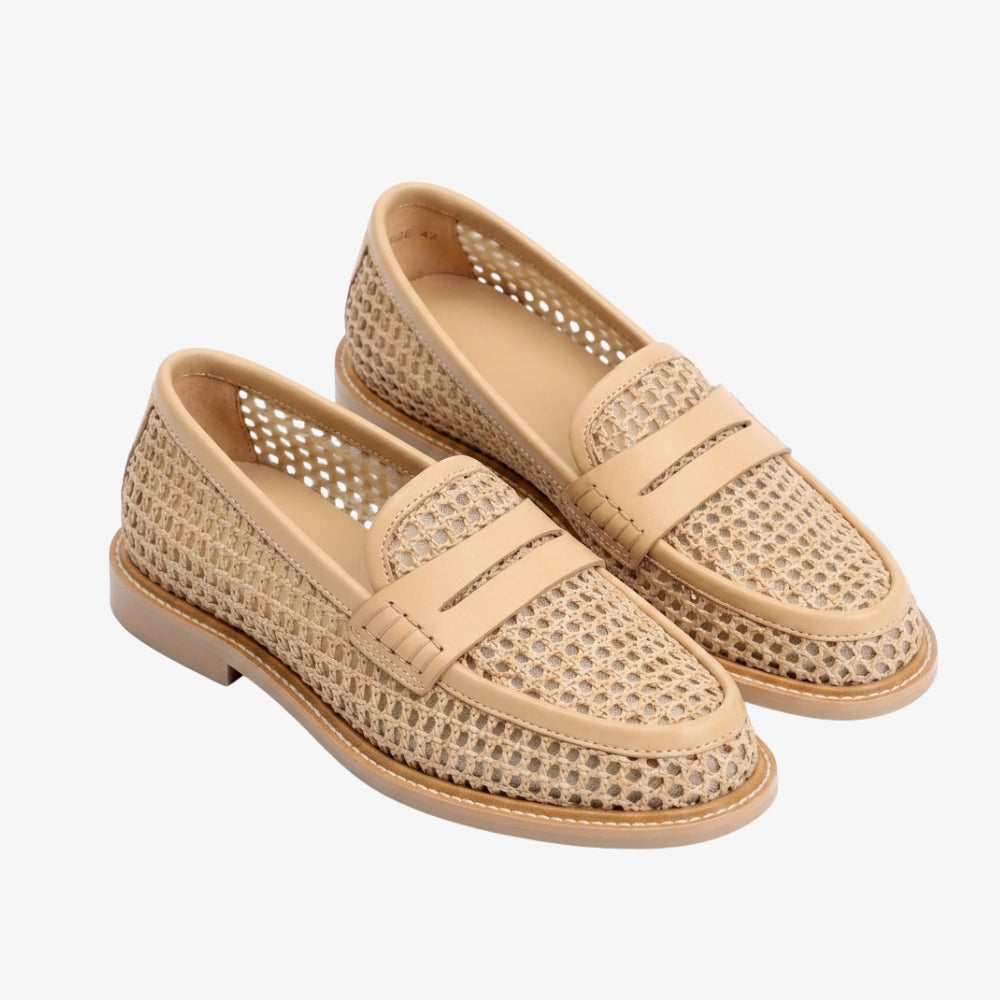 Women's beige mesh and leather loafer on a gray background