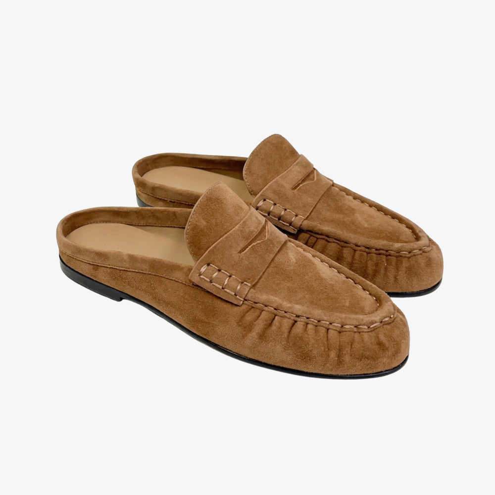 Brown suede mule loafer for women, on a gray background