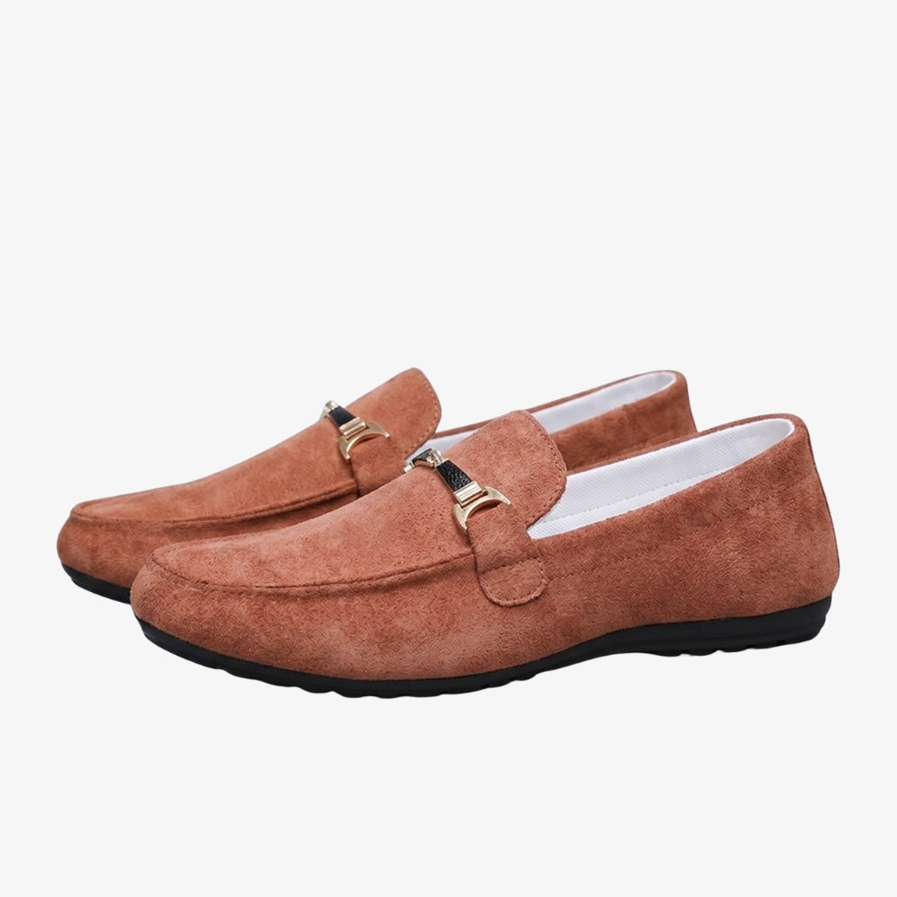 Men's cognac faux suede loafer on a gray background