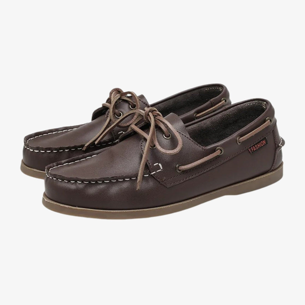 Men's boat loafers in brown leather, on a gray background