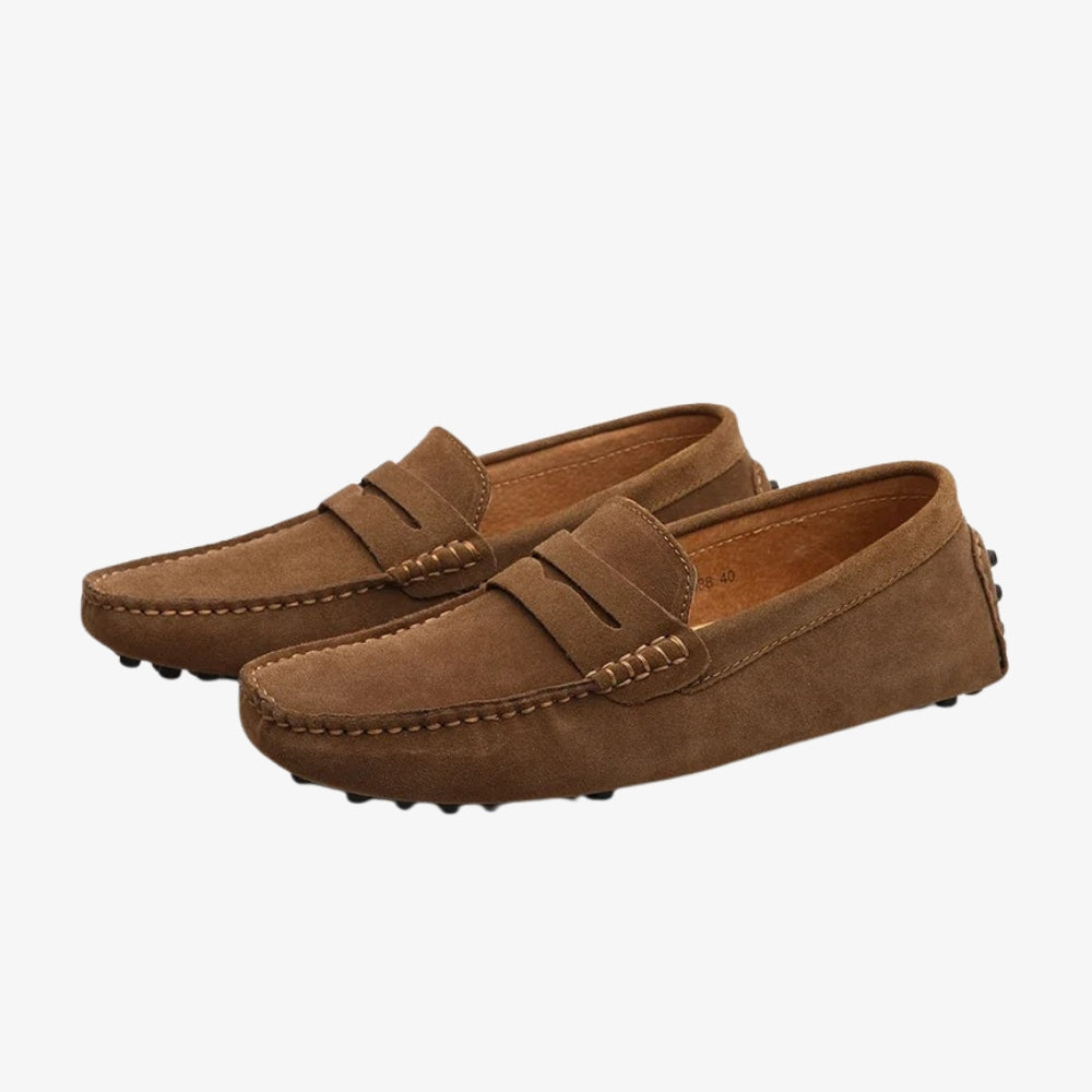Men's brown suede loafer, penny loafer cut, on a gray background