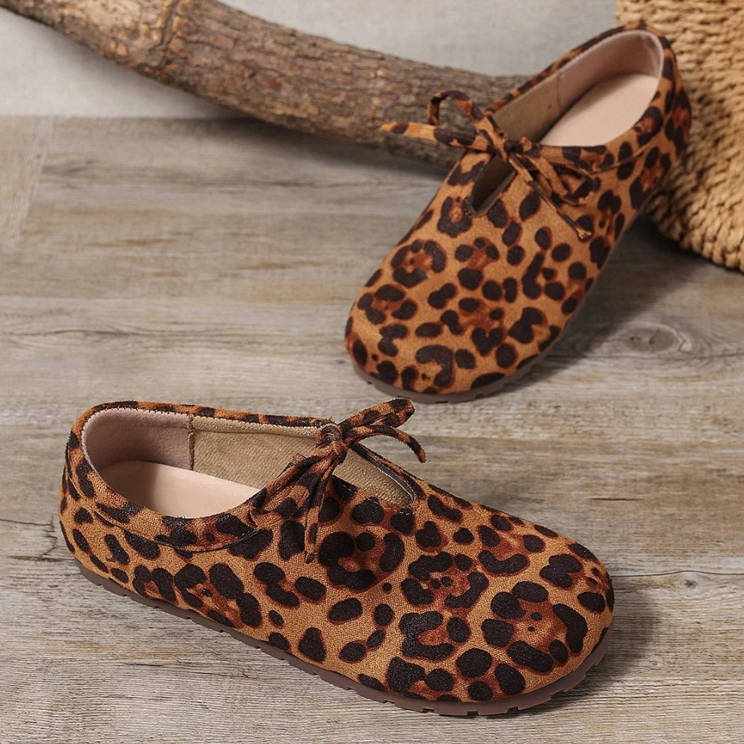 Women's leopard faux suede loafers with a bow