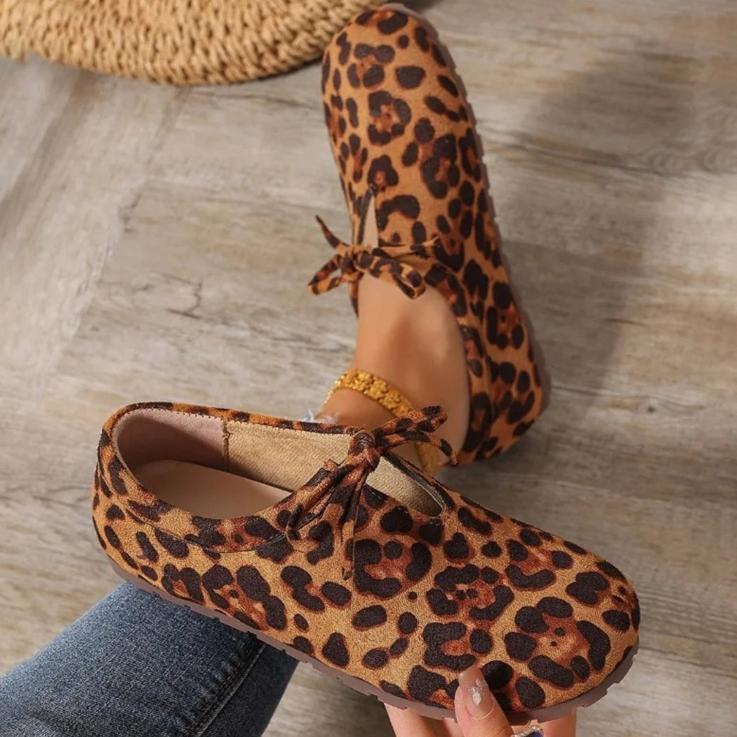 Women's leopard faux suede loafers with a bow