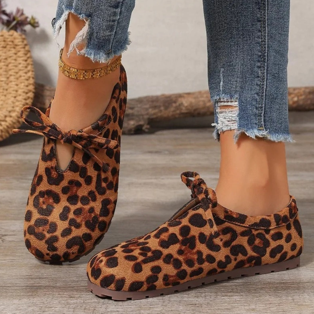 Women's leopard faux suede loafers with a bow