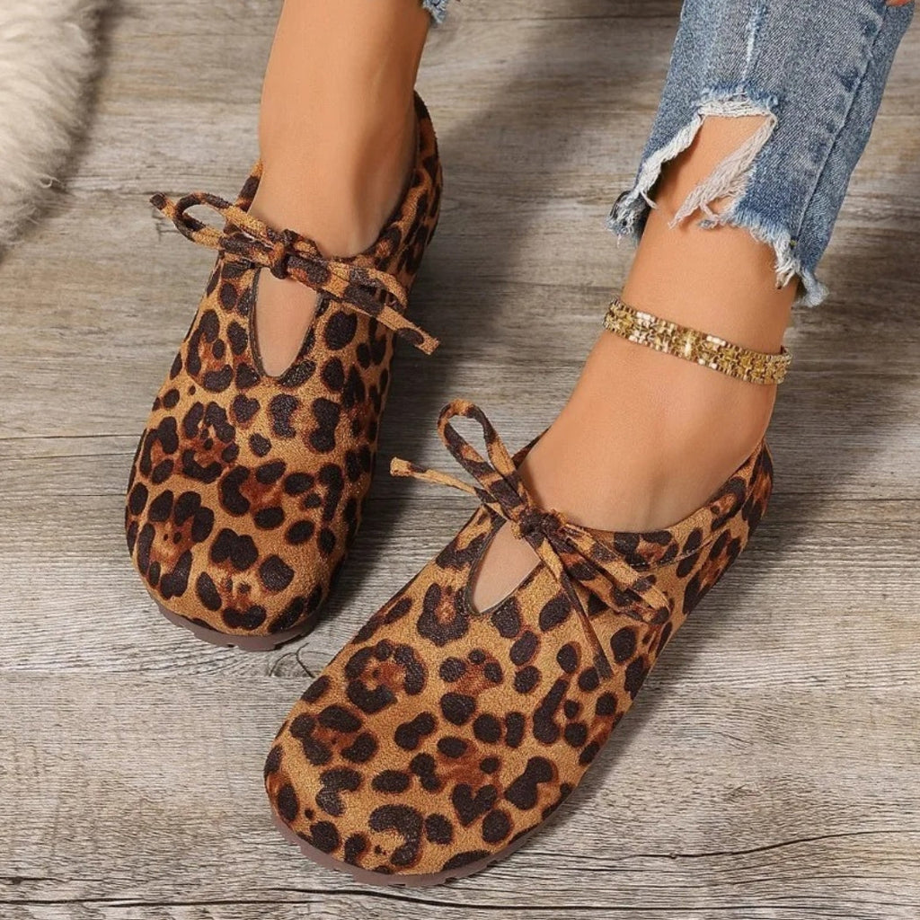 Women's leopard faux suede loafers with a bow