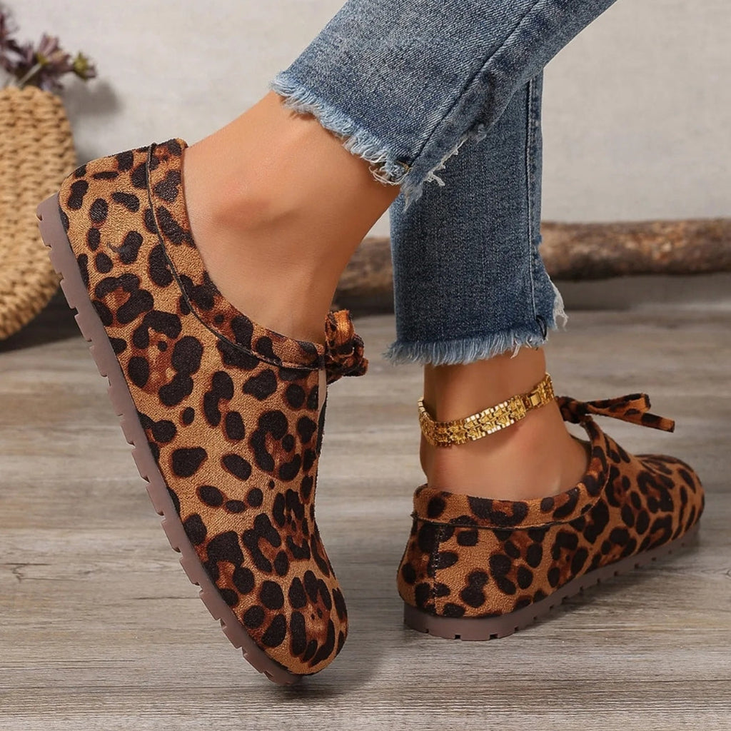 Women's leopard faux suede loafers with a bow
