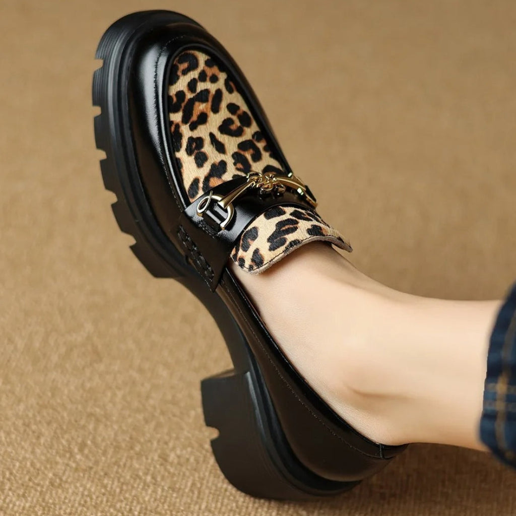 Women's black leather loafers with leopard print and heels