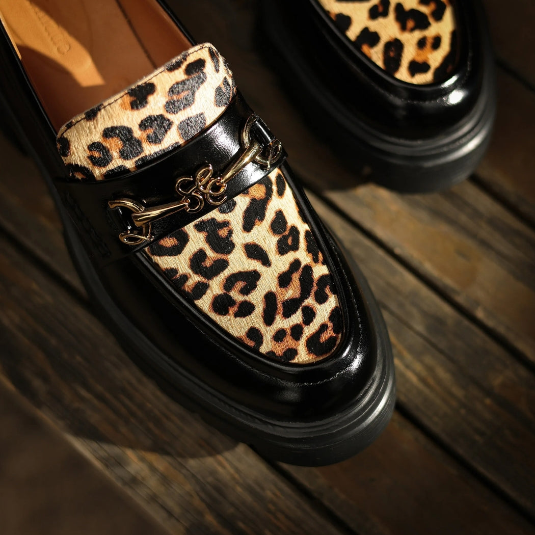 Women's black leather loafers with leopard print and heels