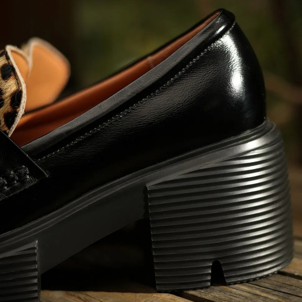 Women's black leather loafers with leopard print and heels