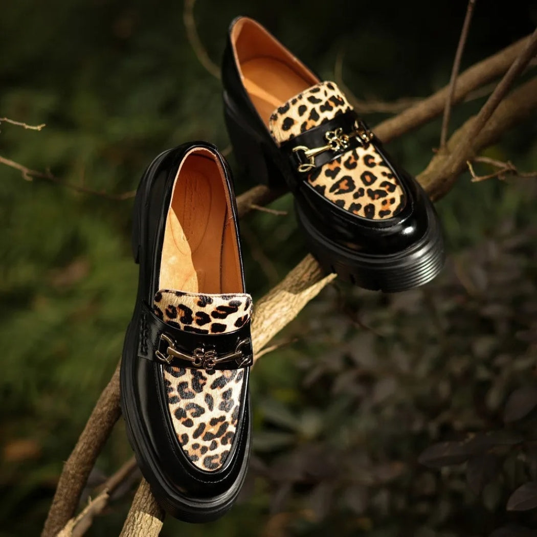 Women's black leather loafers with leopard print and heels