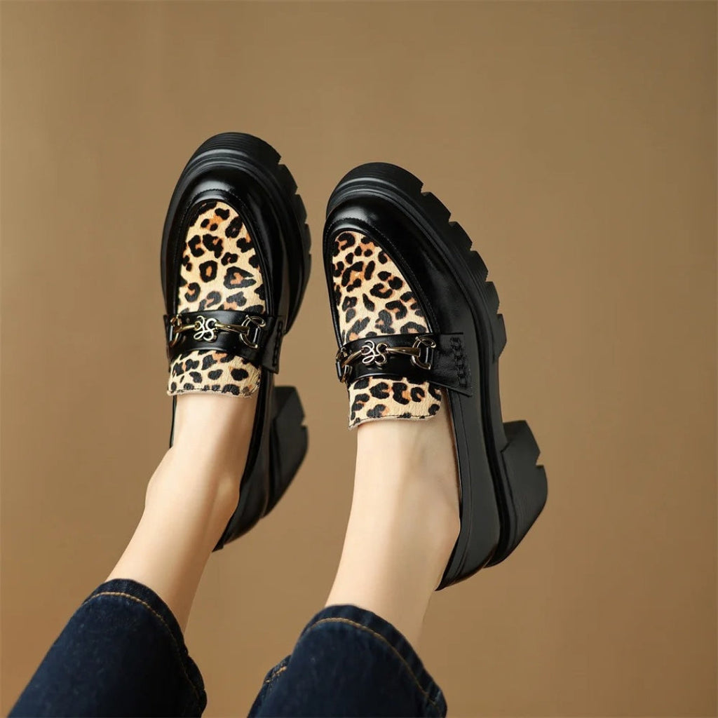Women's black leather loafers with leopard print and heels
