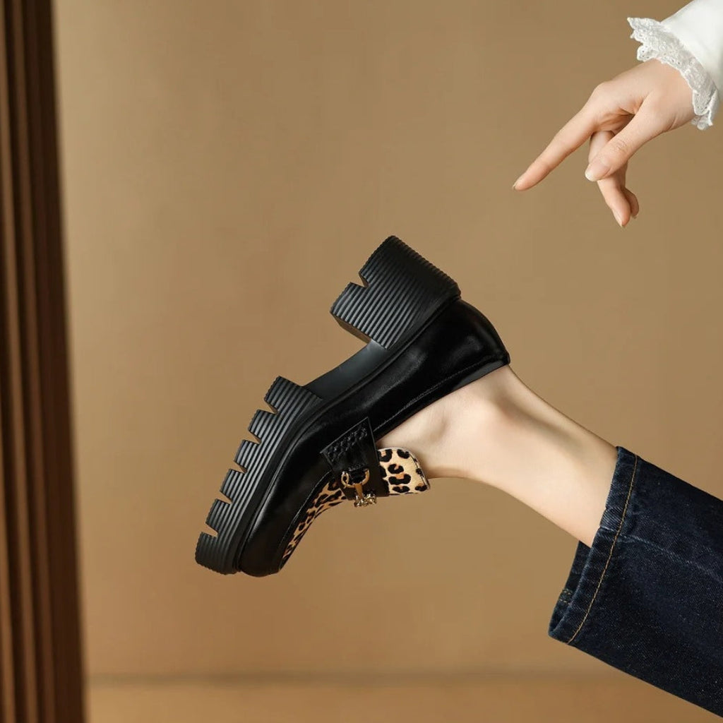 Women's black leather loafers with leopard print and heels