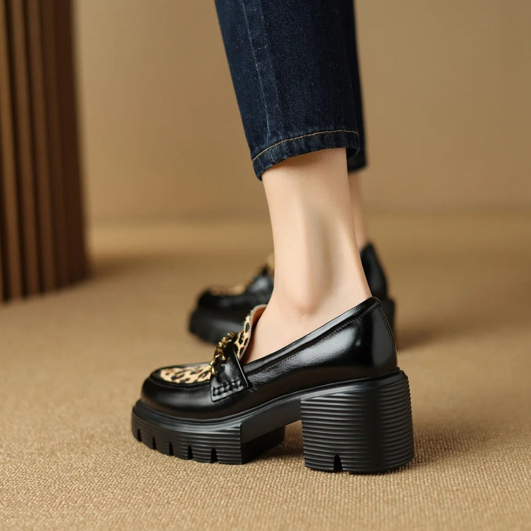 Women's black leather loafers with leopard print and heels