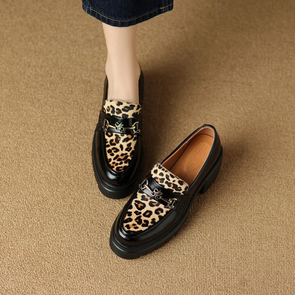Women's black leather loafers with leopard print and heels
