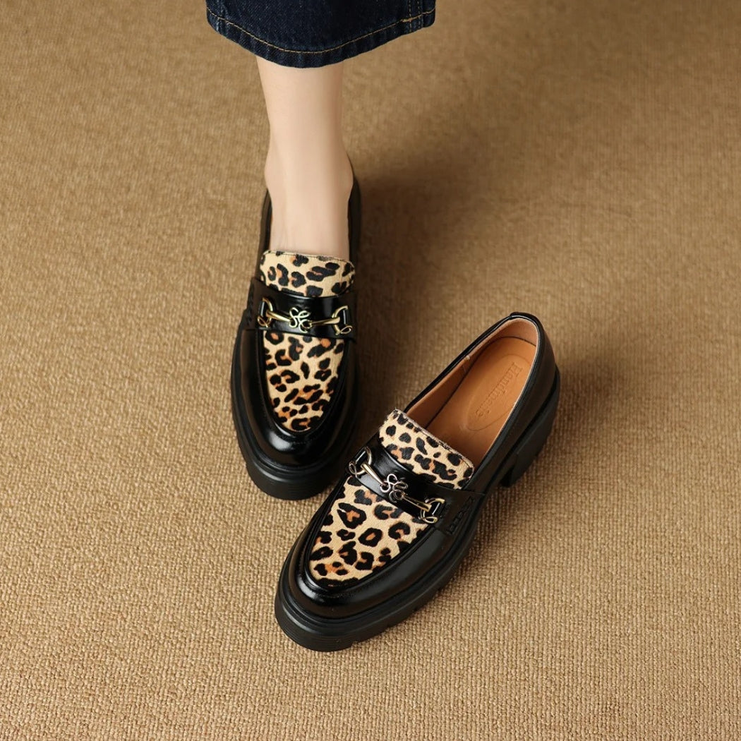 Women's black leather loafers with leopard print and heels