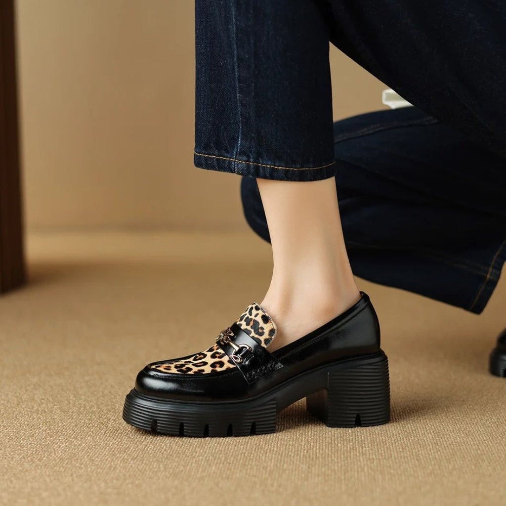 Women's black leather loafers with leopard print and heels
