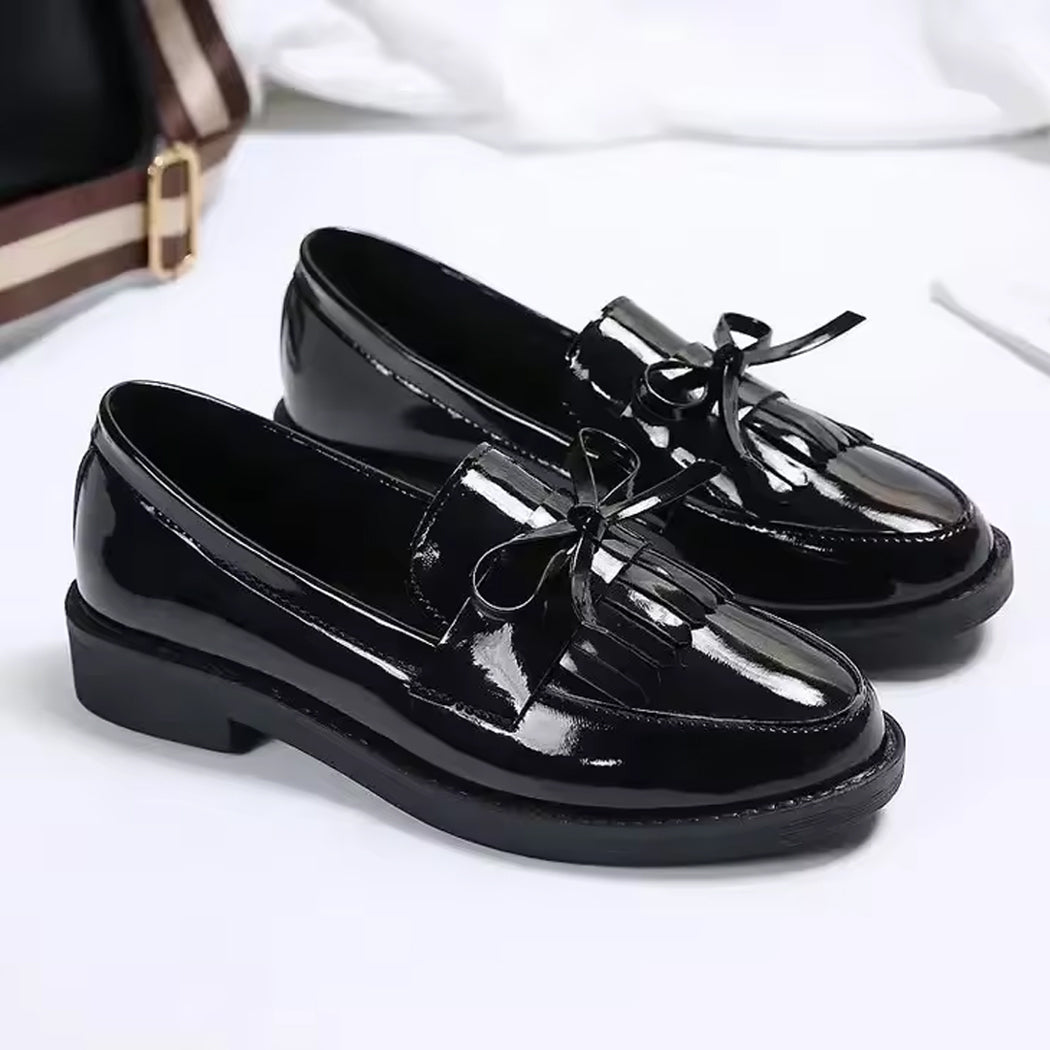 Patent loafers with fringe and bow