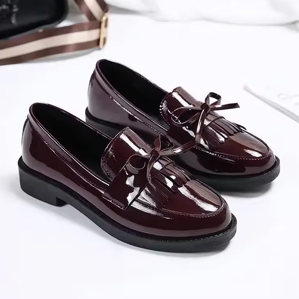 Patent loafers with fringe and bow