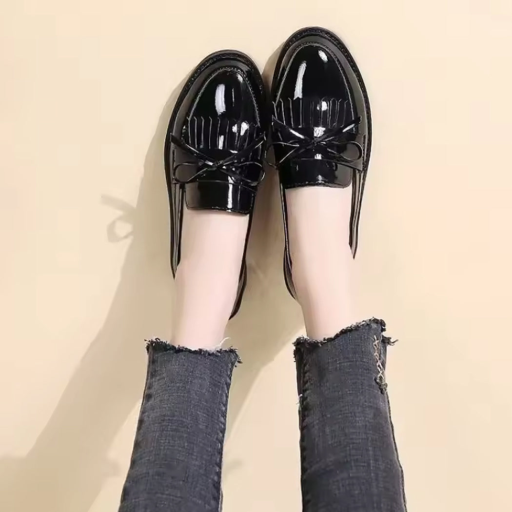 Patent loafers with fringe and bow