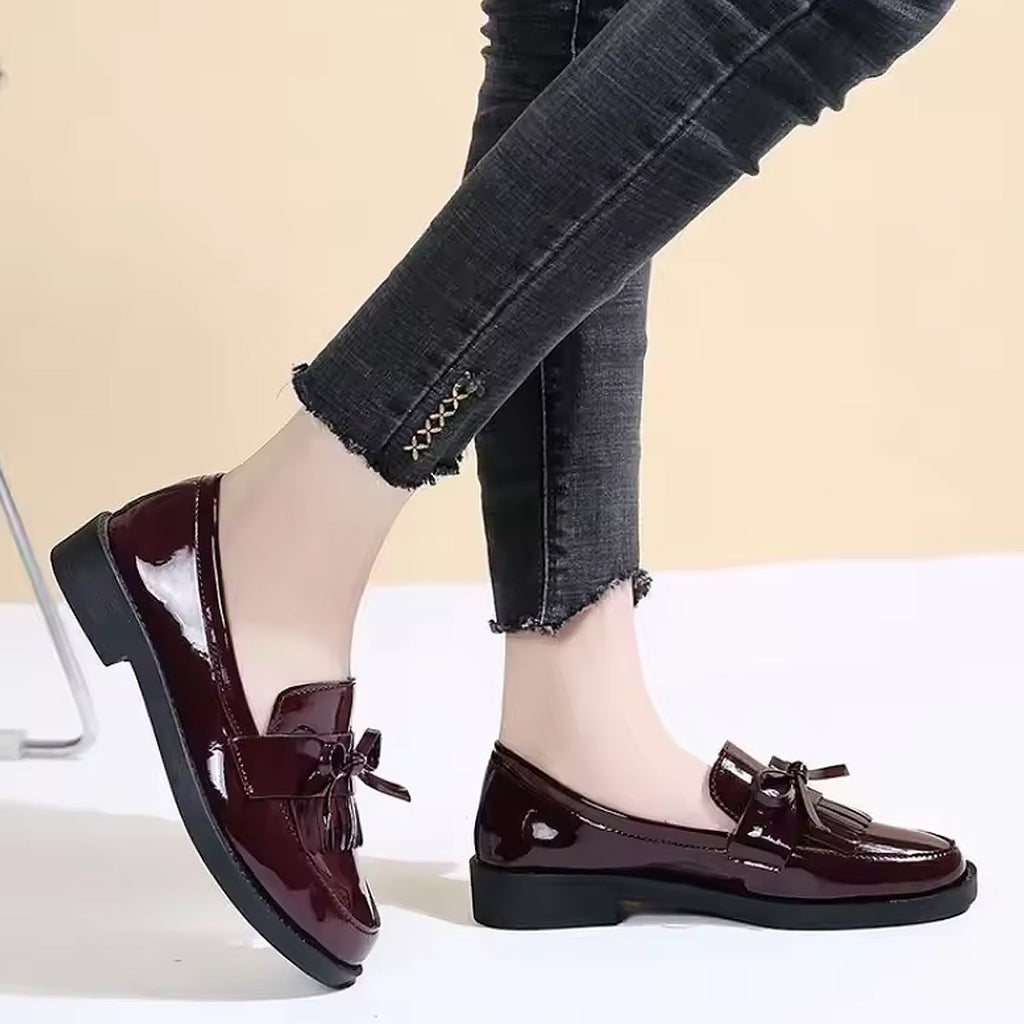 Patent loafers with fringe and bow