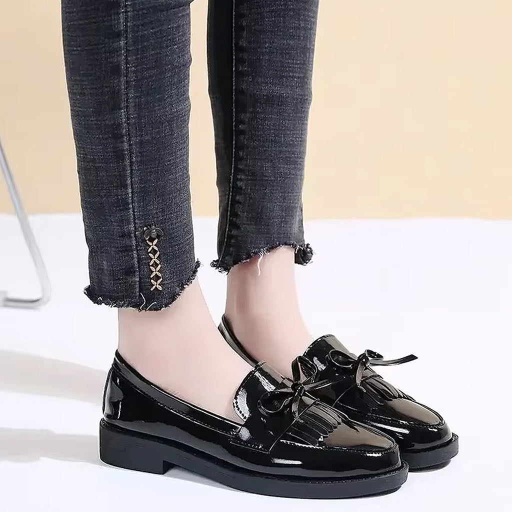 Patent loafers with fringe and bow