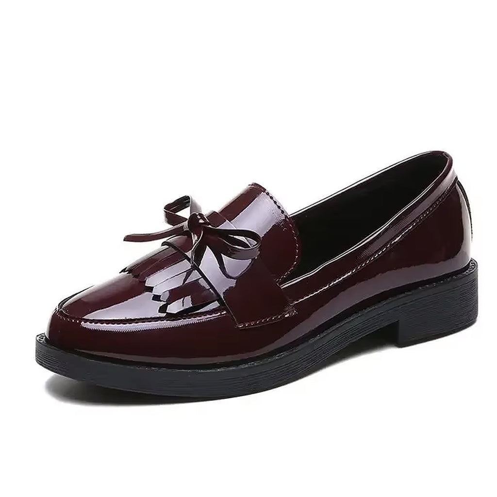 Patent loafers with fringe and bow
