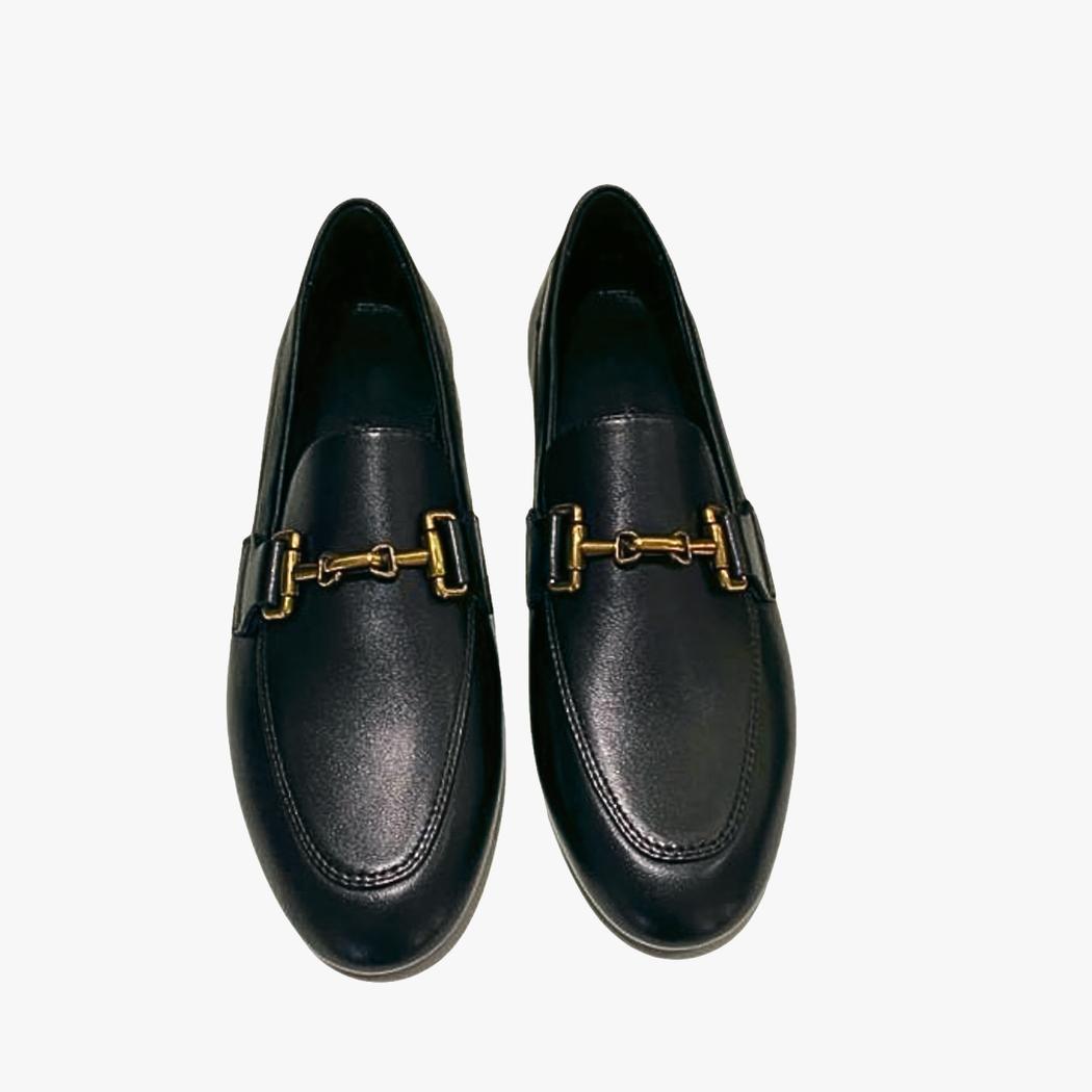 A pair of women's black genuine leather loafers on a white background