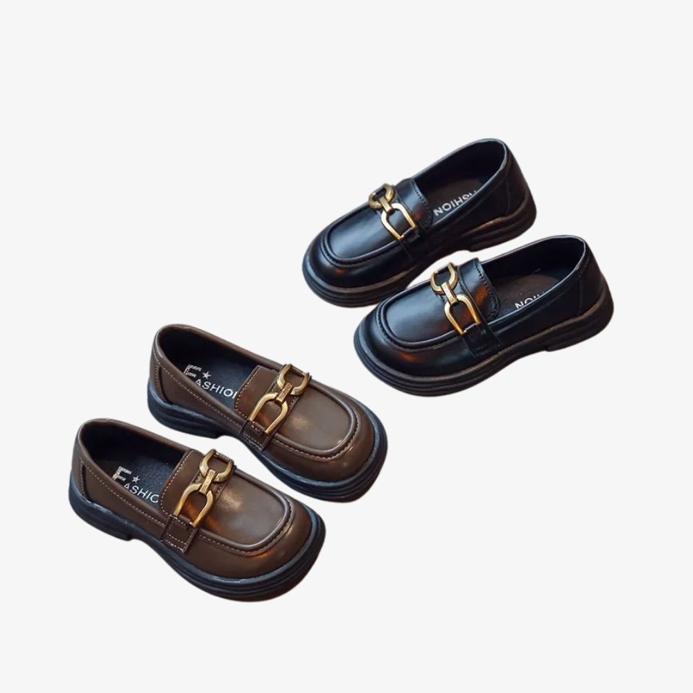 Girls' dark loafers with a polished metal buckle