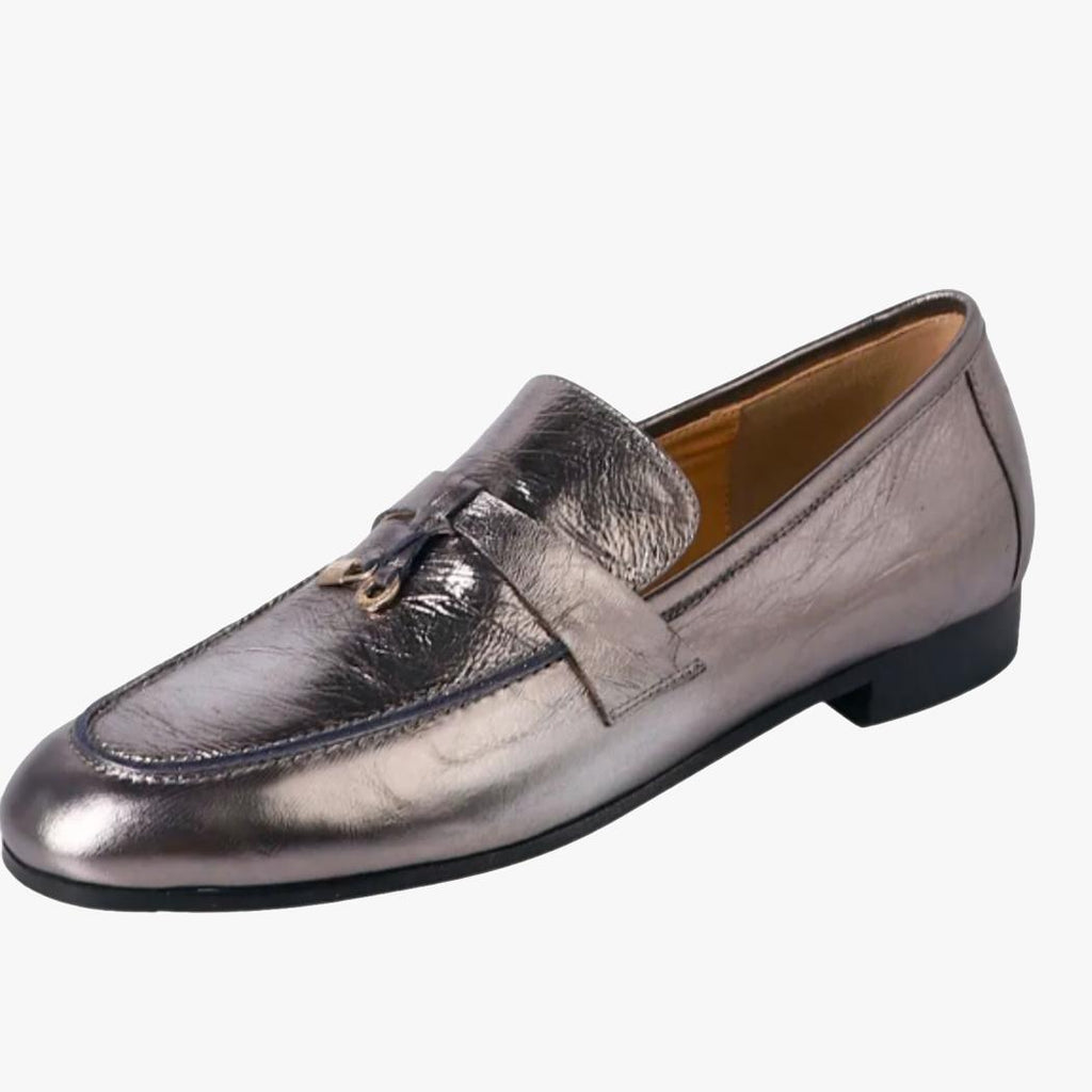 A women's silver genuine leather tassel loafer on a white background