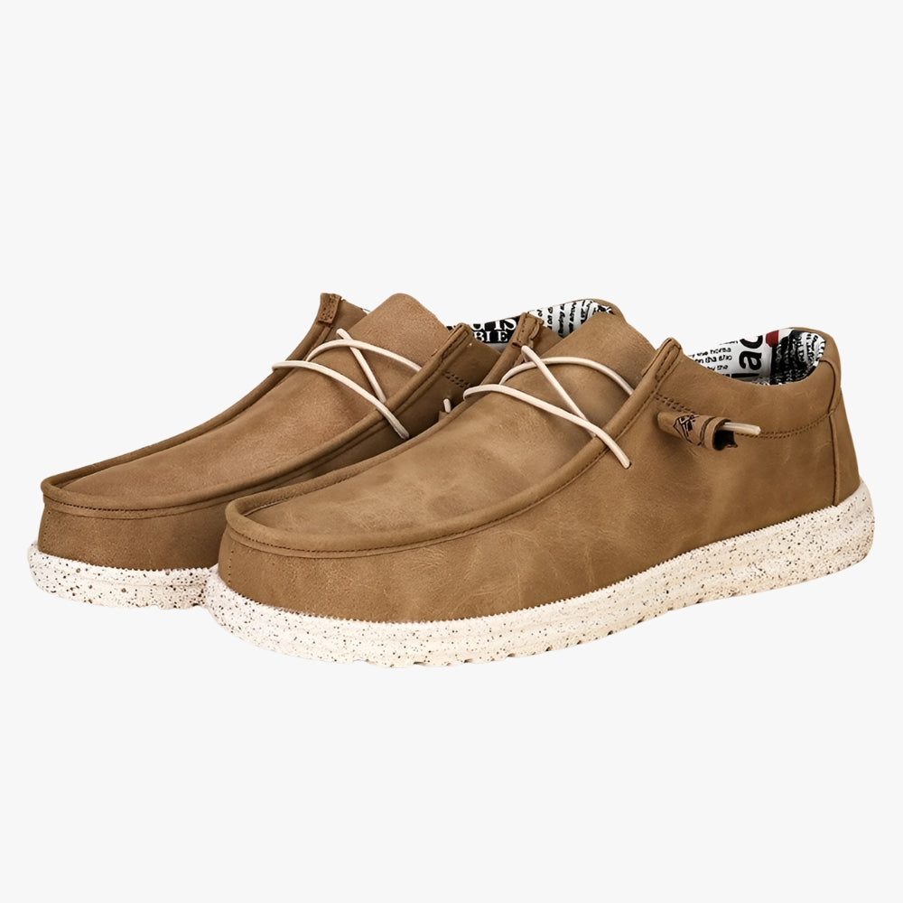Brown faux leather slip-on loafers with a white sole