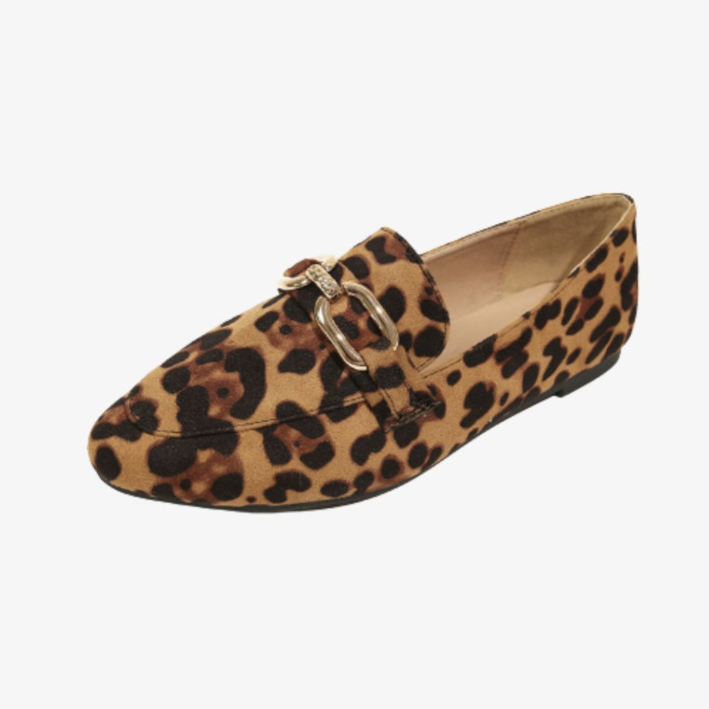 On a light background, an exposed loafer in profile with rounded square toe in leopard-print faux velvet and metallic gold buckles on top. The outsole is flat and black.