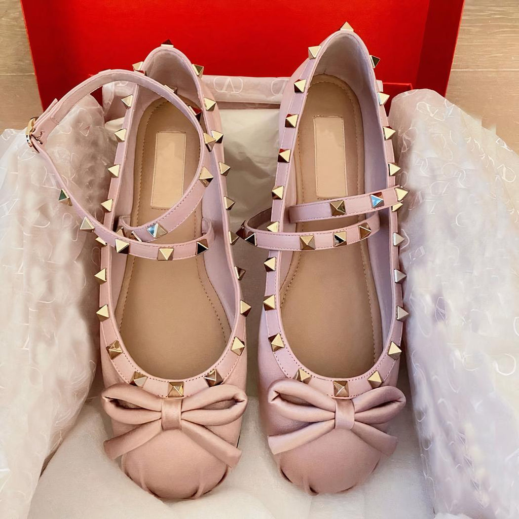 Satin ballet flat loafer with a small bow on the front and a buckle at the ankle