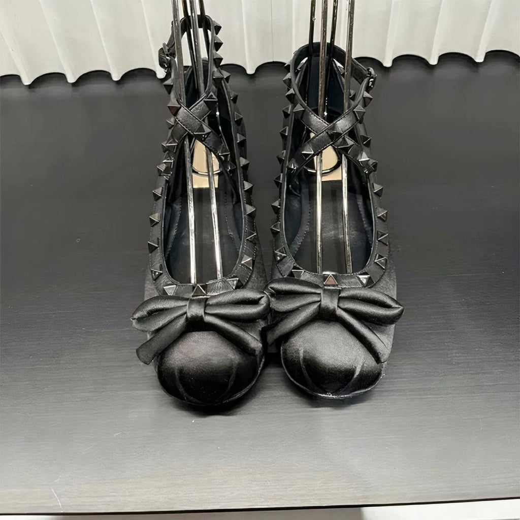Satin ballet flat loafer with a small bow on the front and a buckle at the ankle