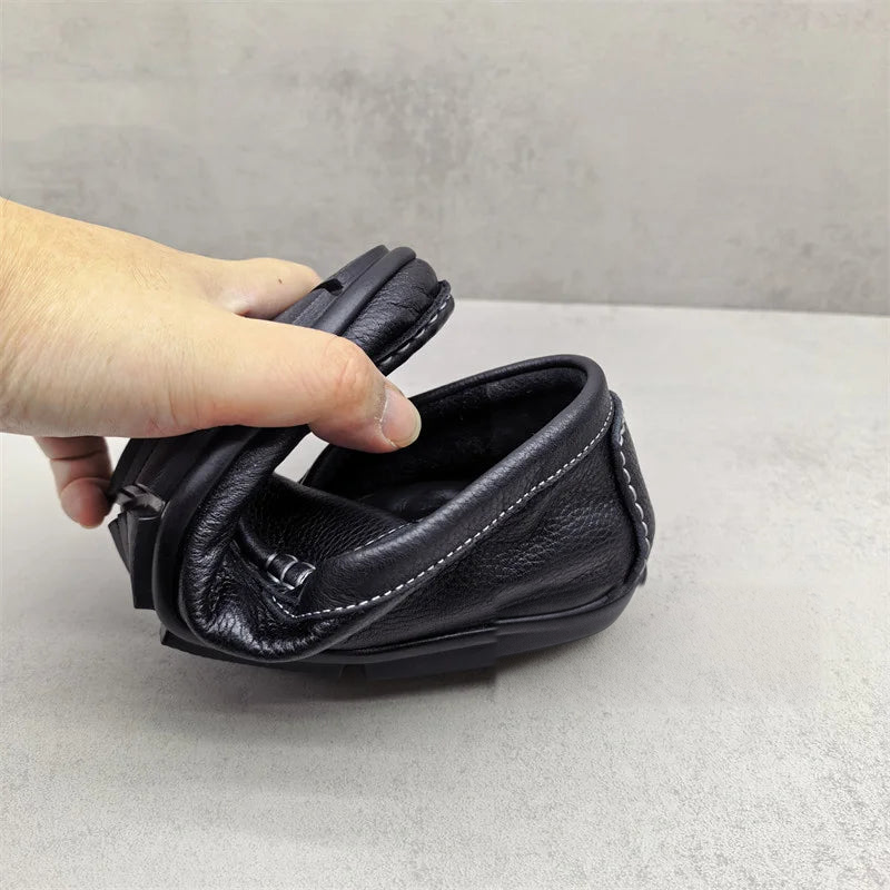 Men's black slip-on loafers with white stitching, view 2