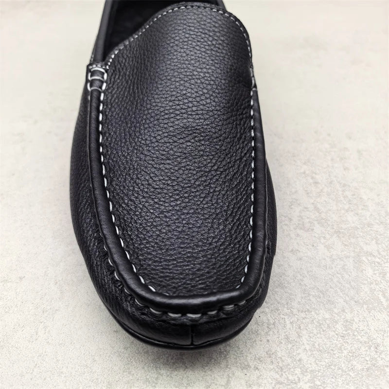 Men's black slip-on loafers with white stitching, view 3