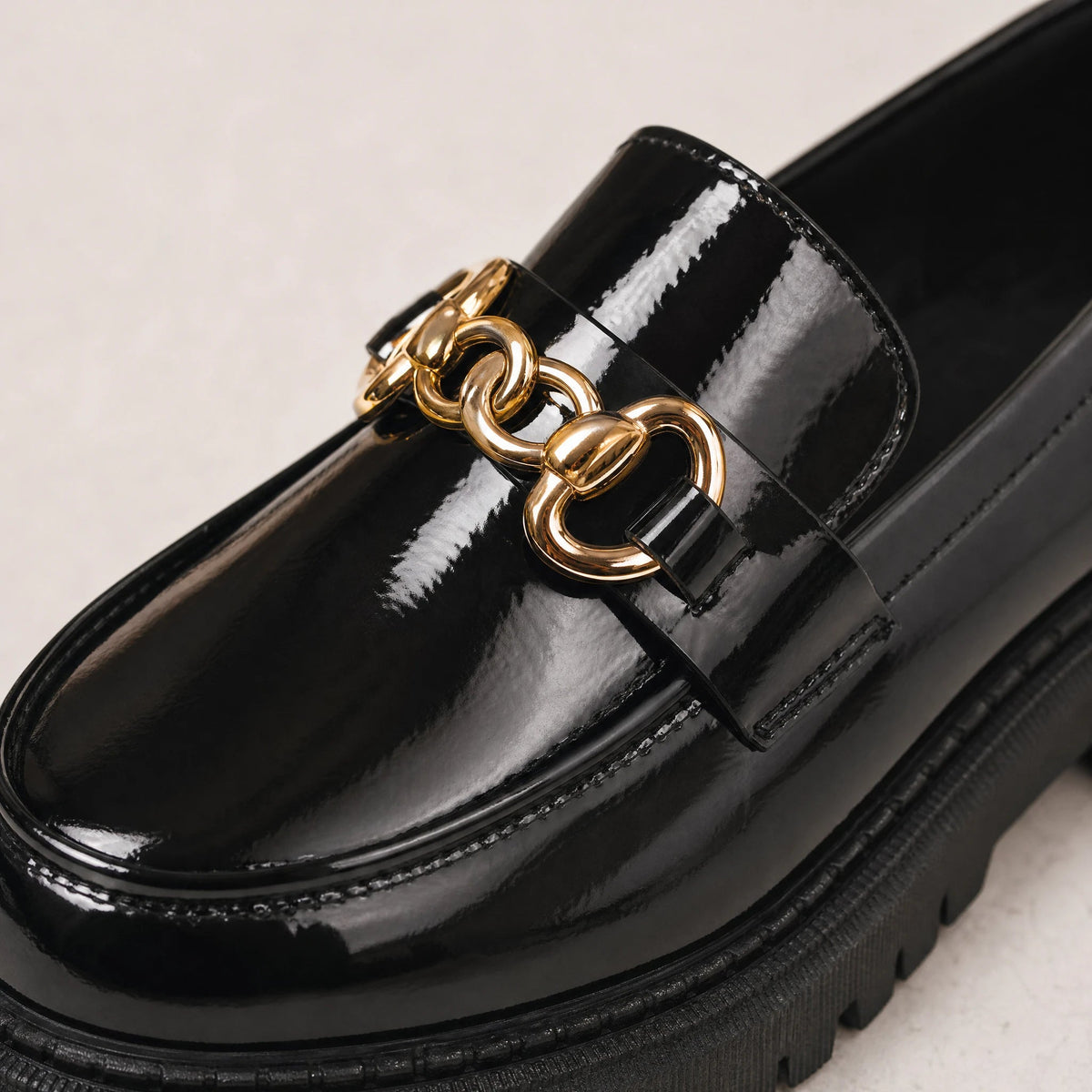 Black platform loafers with gold chain for women in Patent Black, back view
