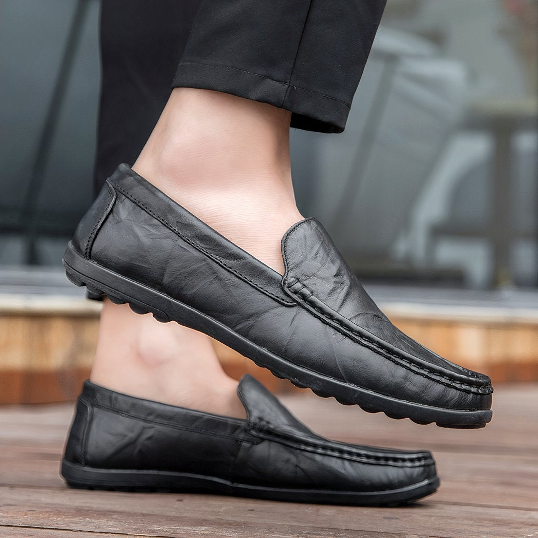 black loafer worn by a man