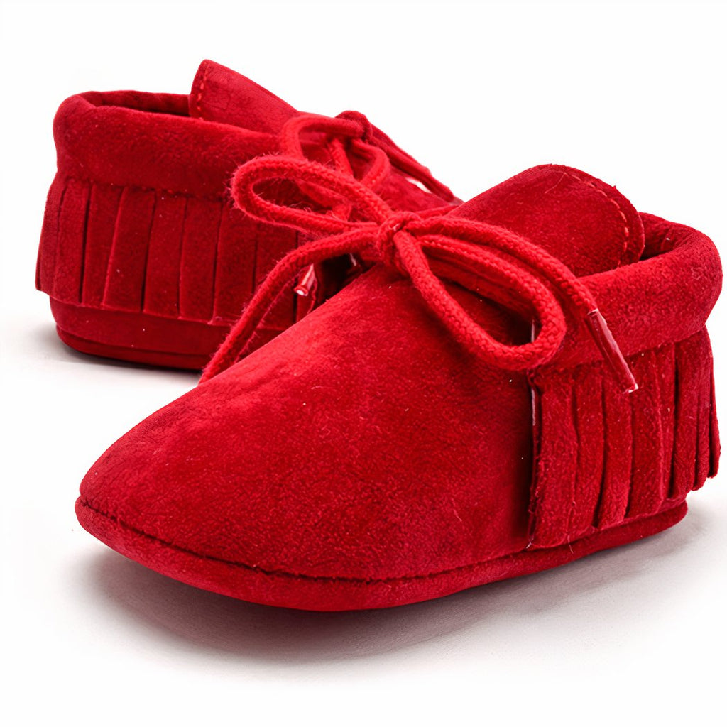 Lace-up baby moccasins with bangs