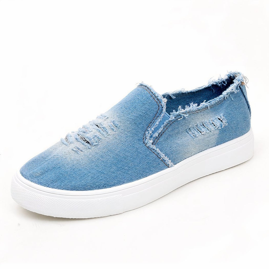 Loafer in faded and torn light denim, profile on white background