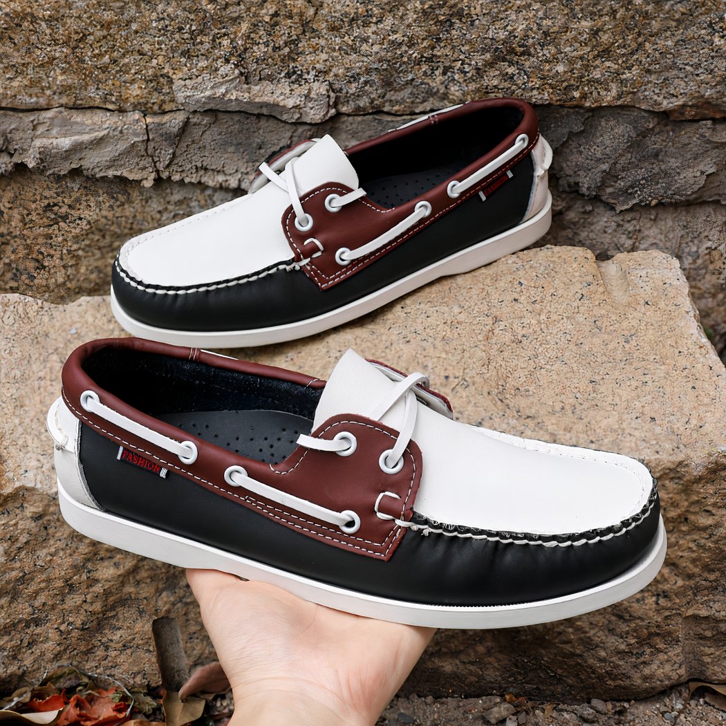 Photo of tricolored boat loafers on stone steps