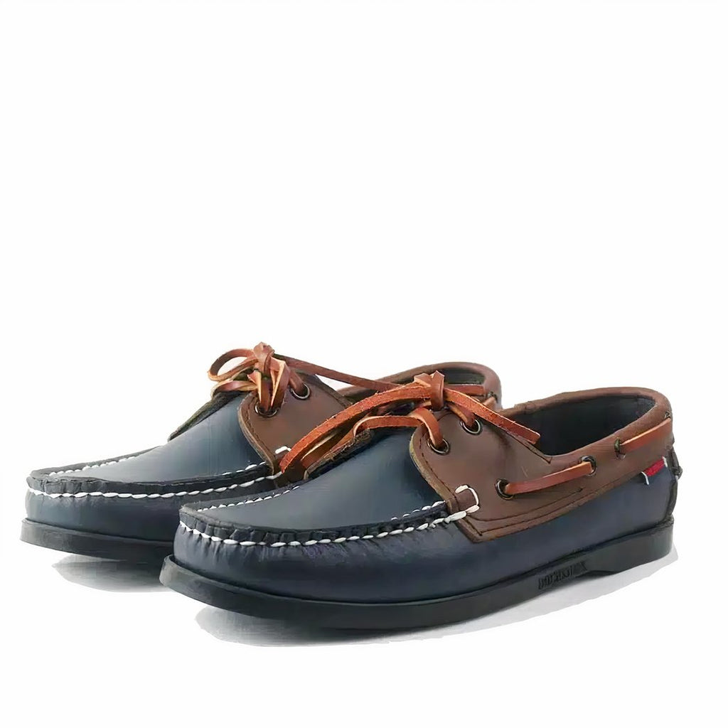 Photo of a pair of blue and brown loafers on a white background