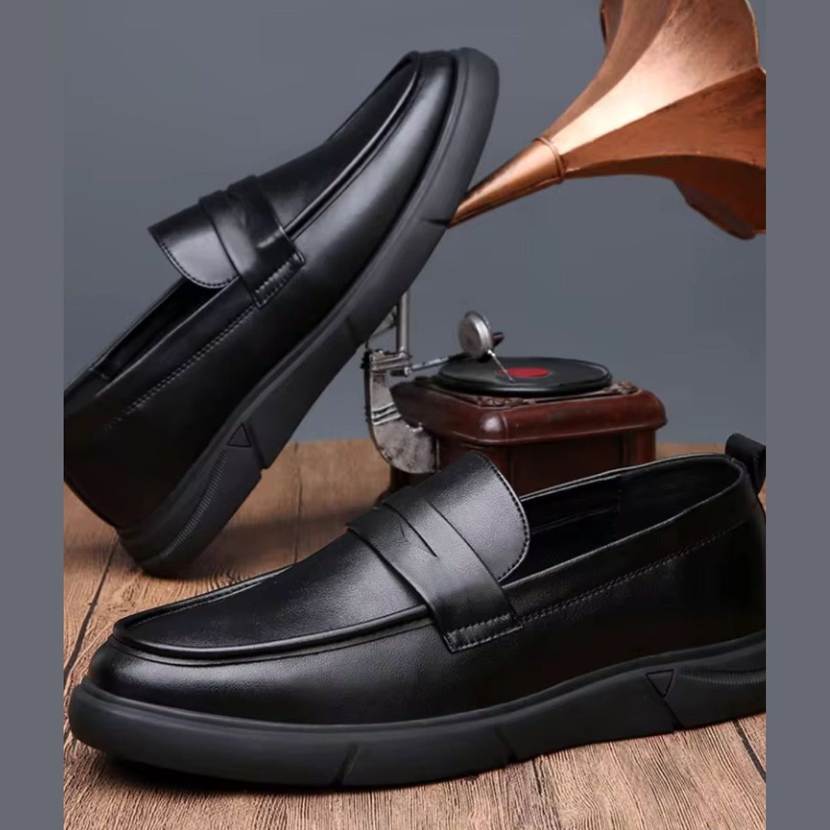 Men's black moccasins worn with chinos