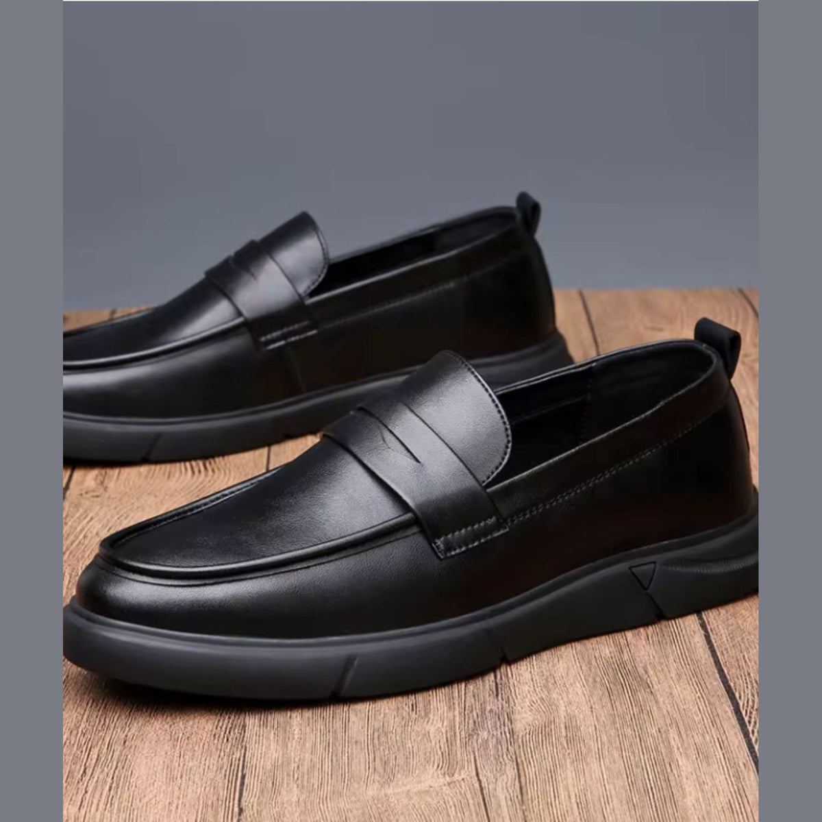 Men's black moccasins worn with jeans