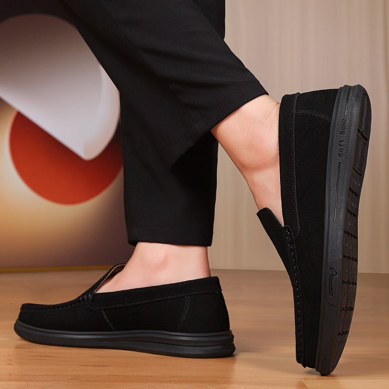 Men's flexible lugged-sole slip-on loafer, black lifestyle shot