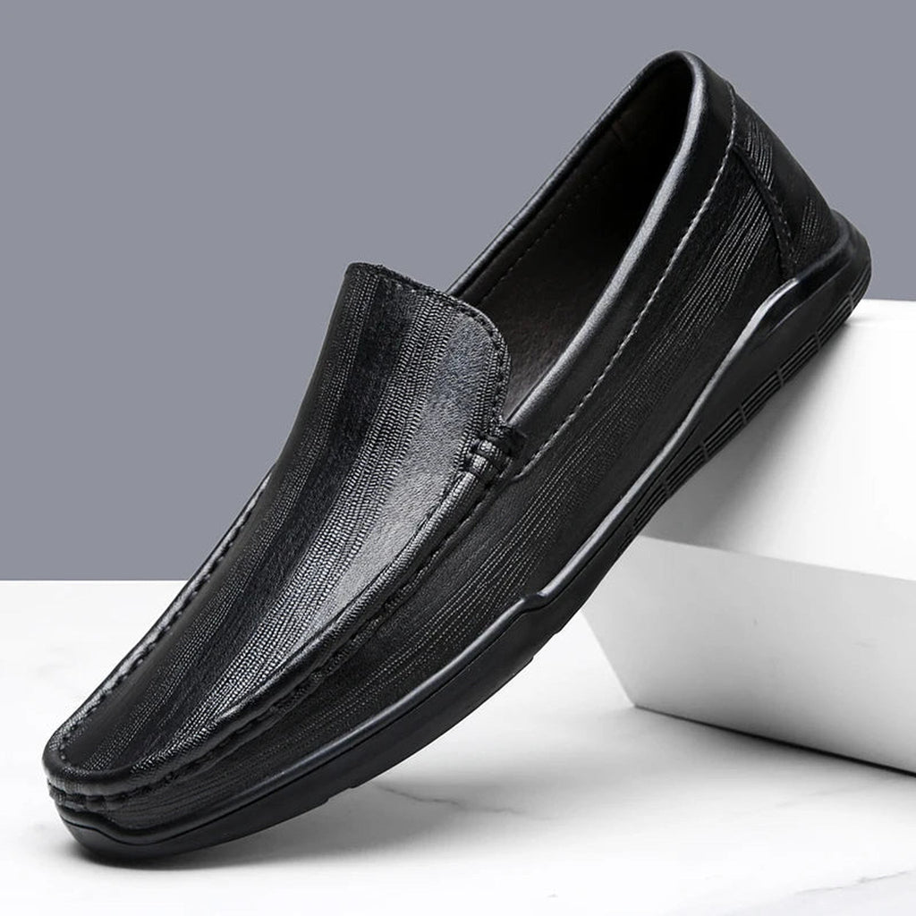 Visible stitching detail on leather loafer