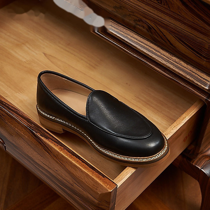 Men's dress loafer with visible stitching, beige three-quarter view