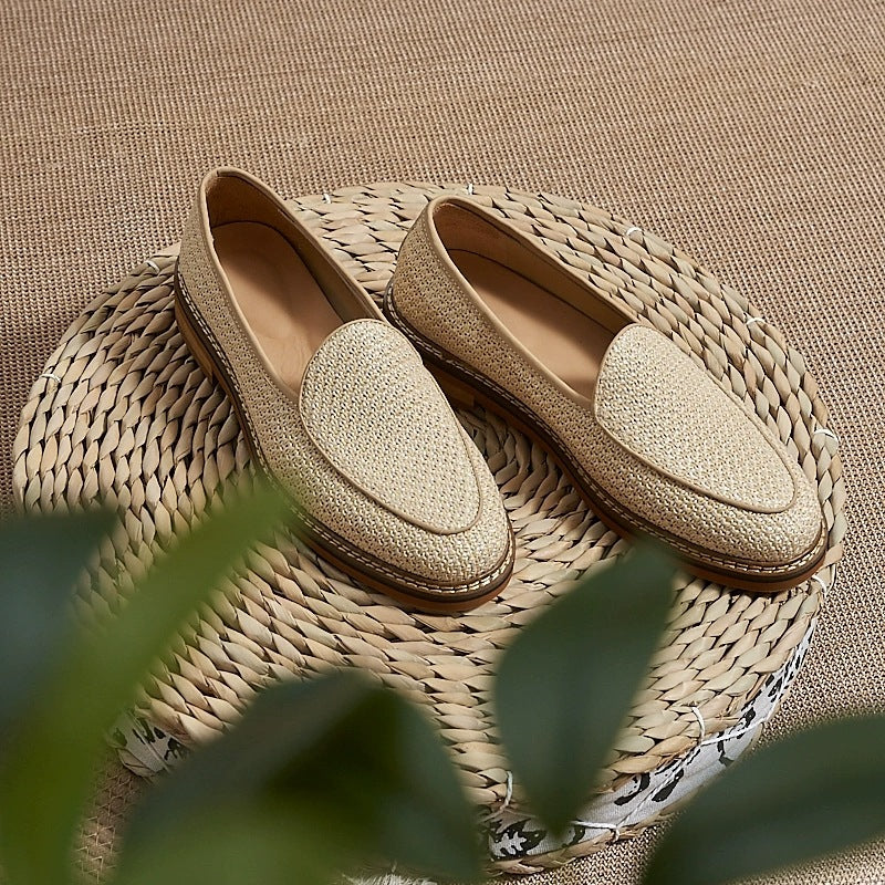 Men's dress loafer with visible stitching, beige worn on foot