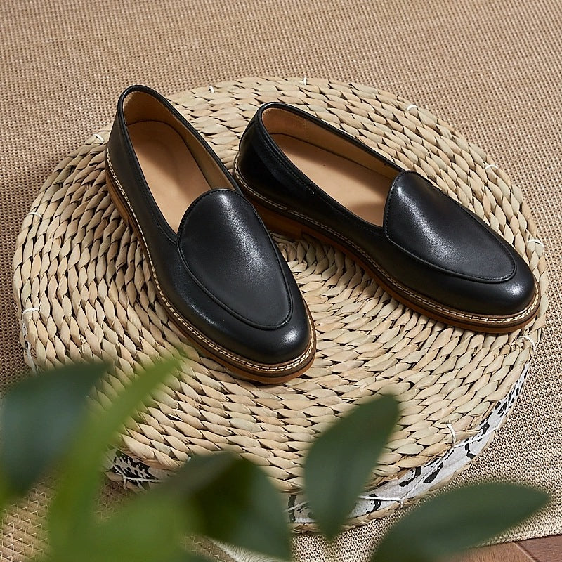 Men's dress loafer with visible stitching, black pair seen from above