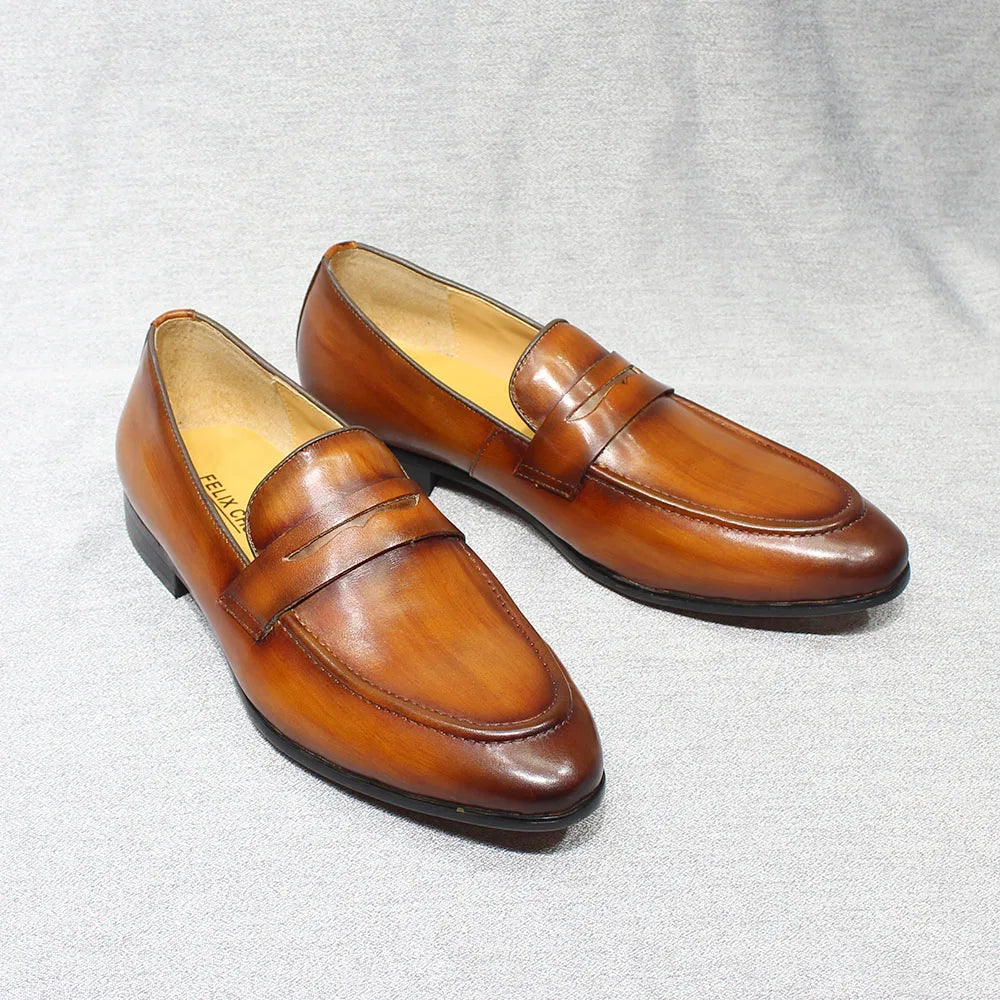Men's hand-patinated leather penny loafer in Dark brown